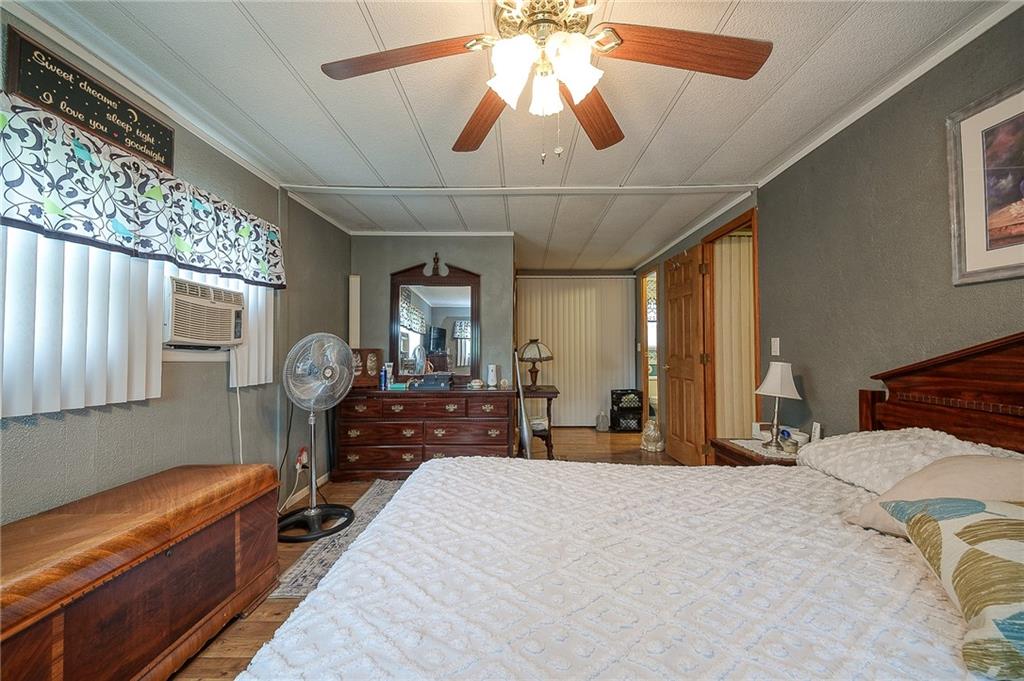 120 Purvis Road Butler, PA 16001 - Photo 13 of 27 a bedroom with furniture and a chandelier