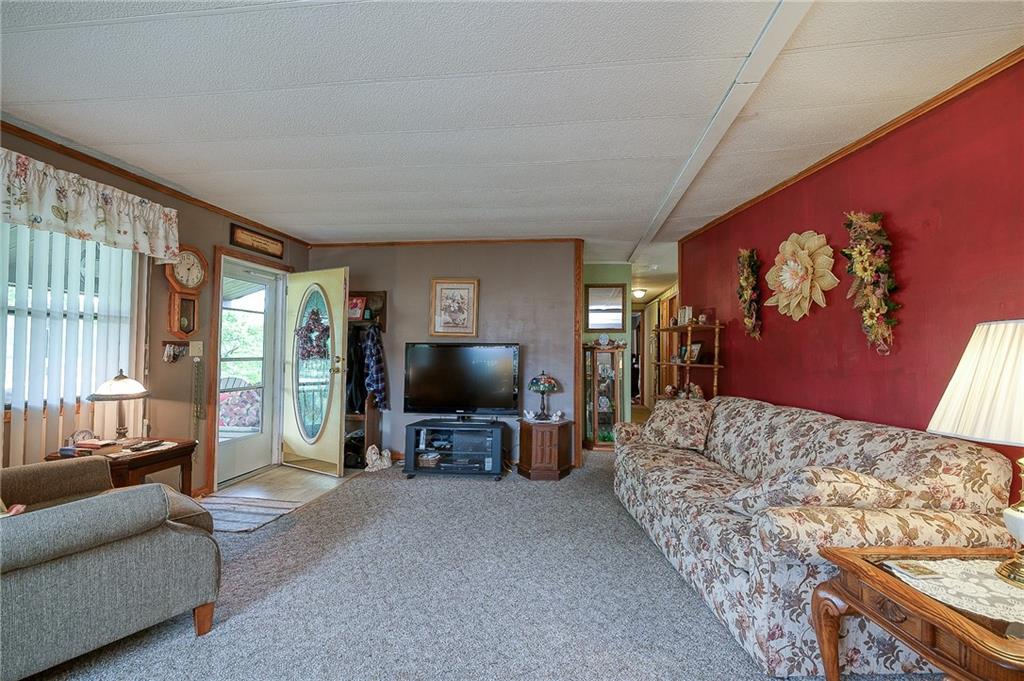 120 Purvis Road Butler, PA 16001 - Photo 3 of 27 a living room with furniture and a flat screen tv