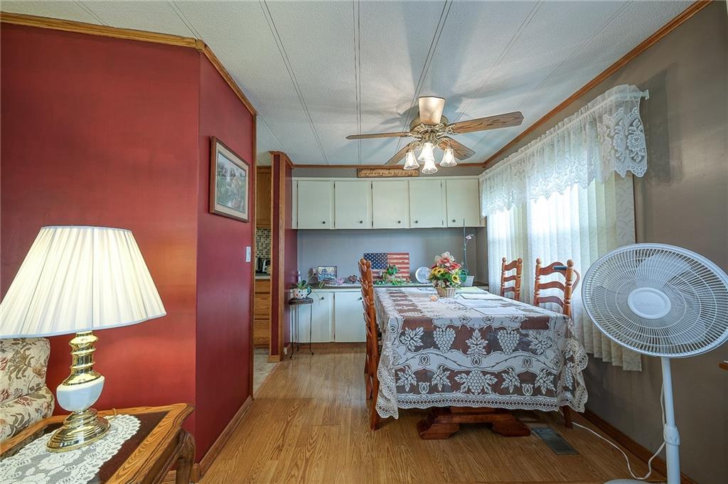 120 Purvis Road Butler, PA 16001 - Photo 5 of 27 a bed room with a bed mirror and a lamp