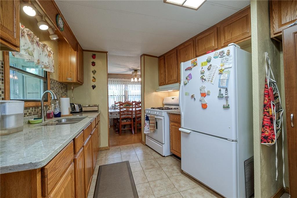 120 Purvis Road Butler, PA 16001 - Photo 6 of 27 a kitchen with stainless steel appliances granite countertop a refrigerator and a sink