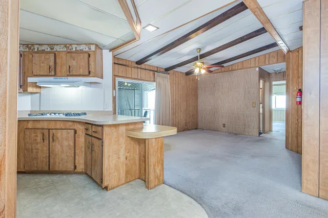 a kitchen with a refrigerator a sink and dishwasher