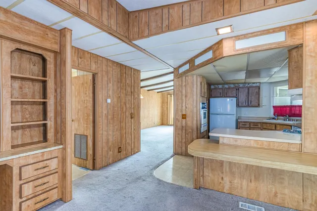 a view of living room with granite countertop furniture and flat screen tv