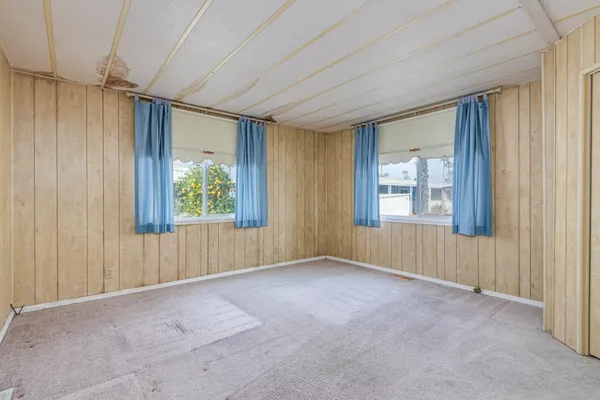a view of a room with large windows and a bathroom