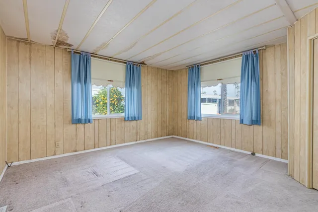 a view of a room with large windows and a bathroom