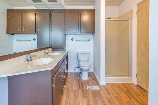 a bathroom with a tub sink and mirror