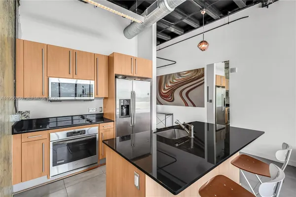 a kitchen with a table and chairs