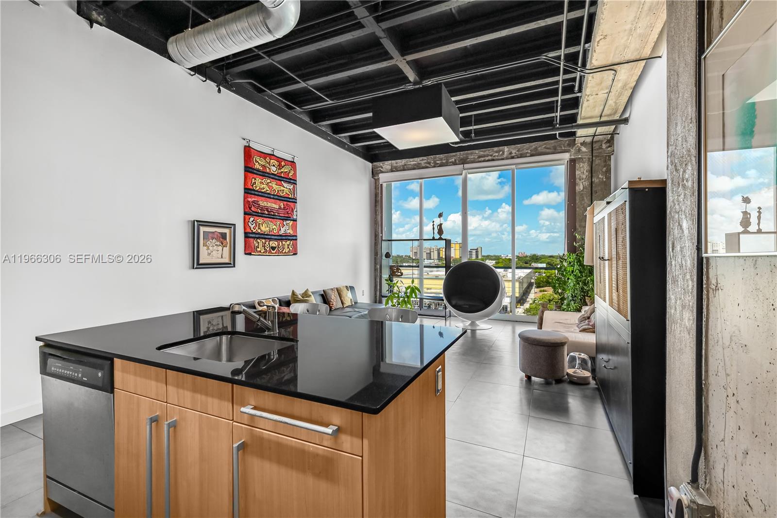 8101 Biscayne Boulevard, Unit R613 Miami, FL 33138 - Photo 12 of 33 a kitchen with a table and chairs