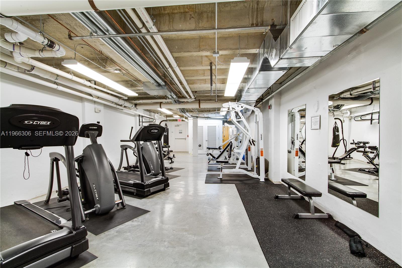 8101 Biscayne Boulevard, Unit R613 Miami, FL 33138 - Photo 18 of 33 a view of a room with gym equipment