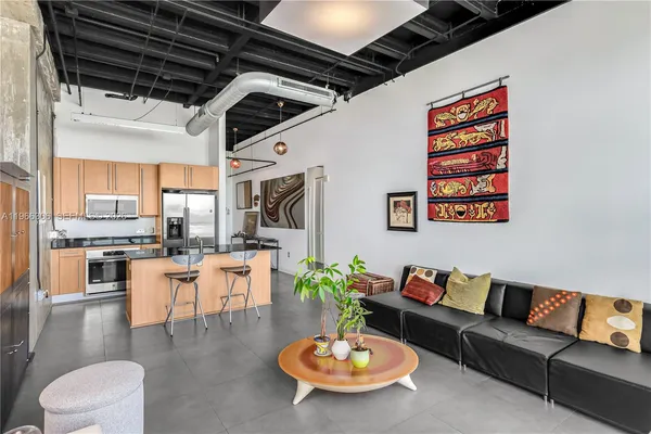 a living room with furniture and a table