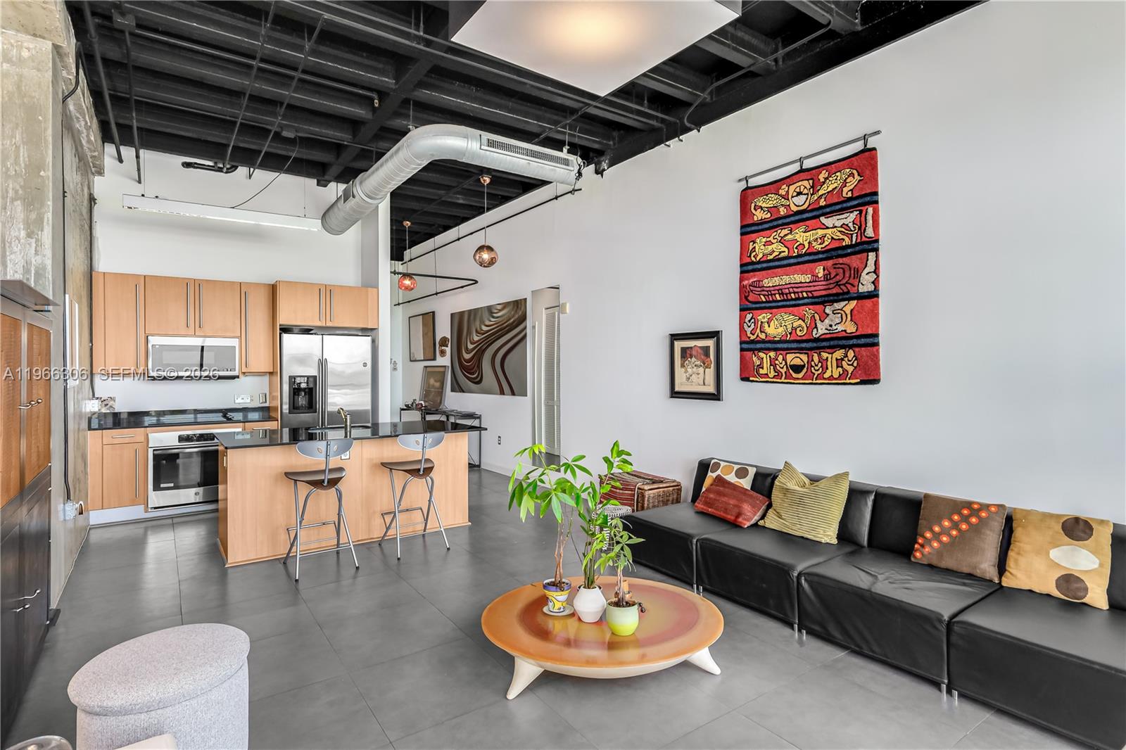 8101 Biscayne Boulevard, Unit R613 Miami, FL 33138 - Photo 3 of 33 a living room with furniture and a table