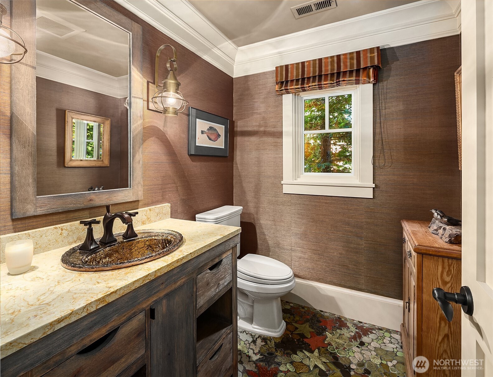 5844 Mutiny Bay Road Freeland, WA 98249 - Photo 12 of 35 a bathroom with a sink a toilet and a mirror