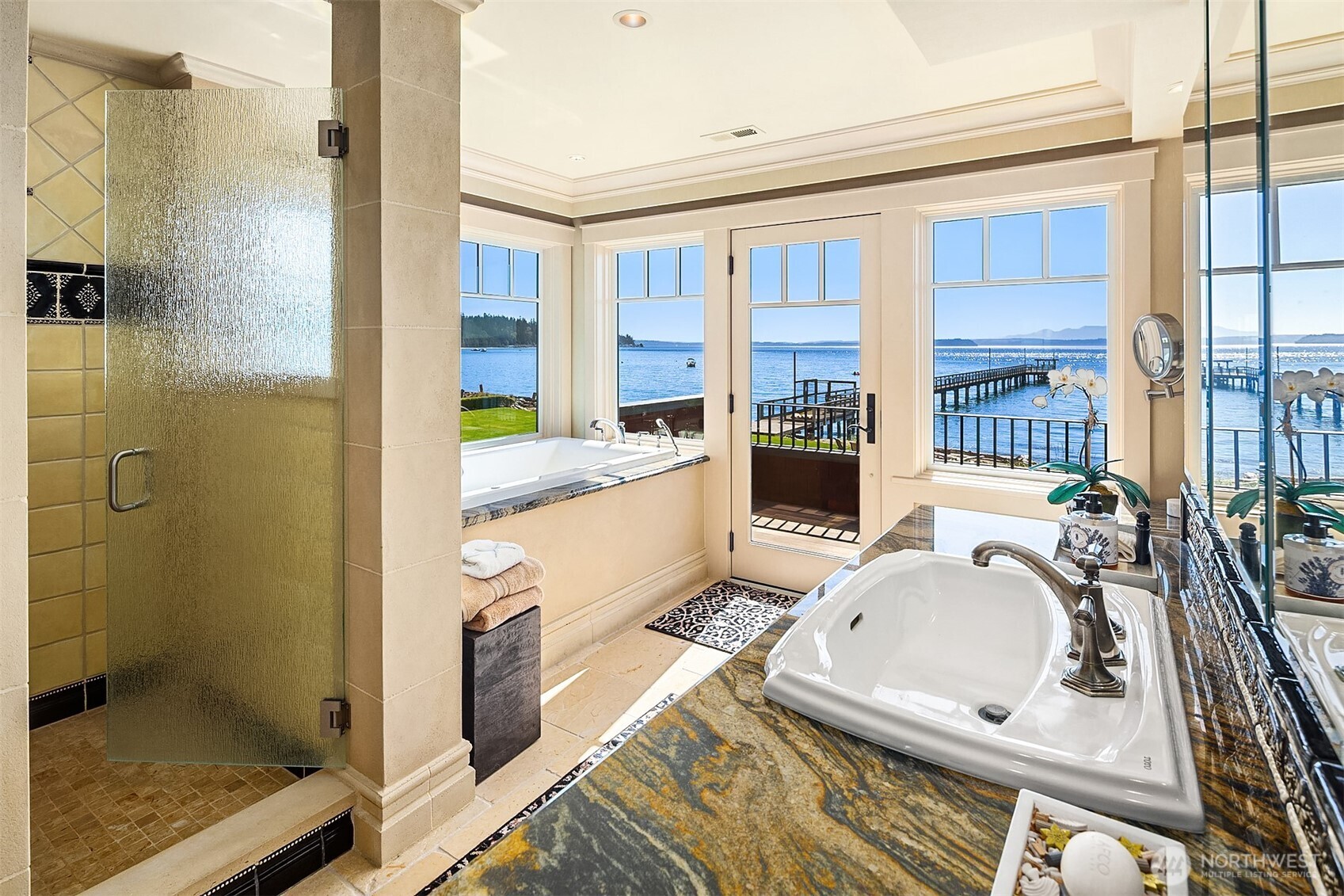 5844 Mutiny Bay Road Freeland, WA 98249 - Photo 26 of 35 a bathroom with a tub sink a mirror and a shower