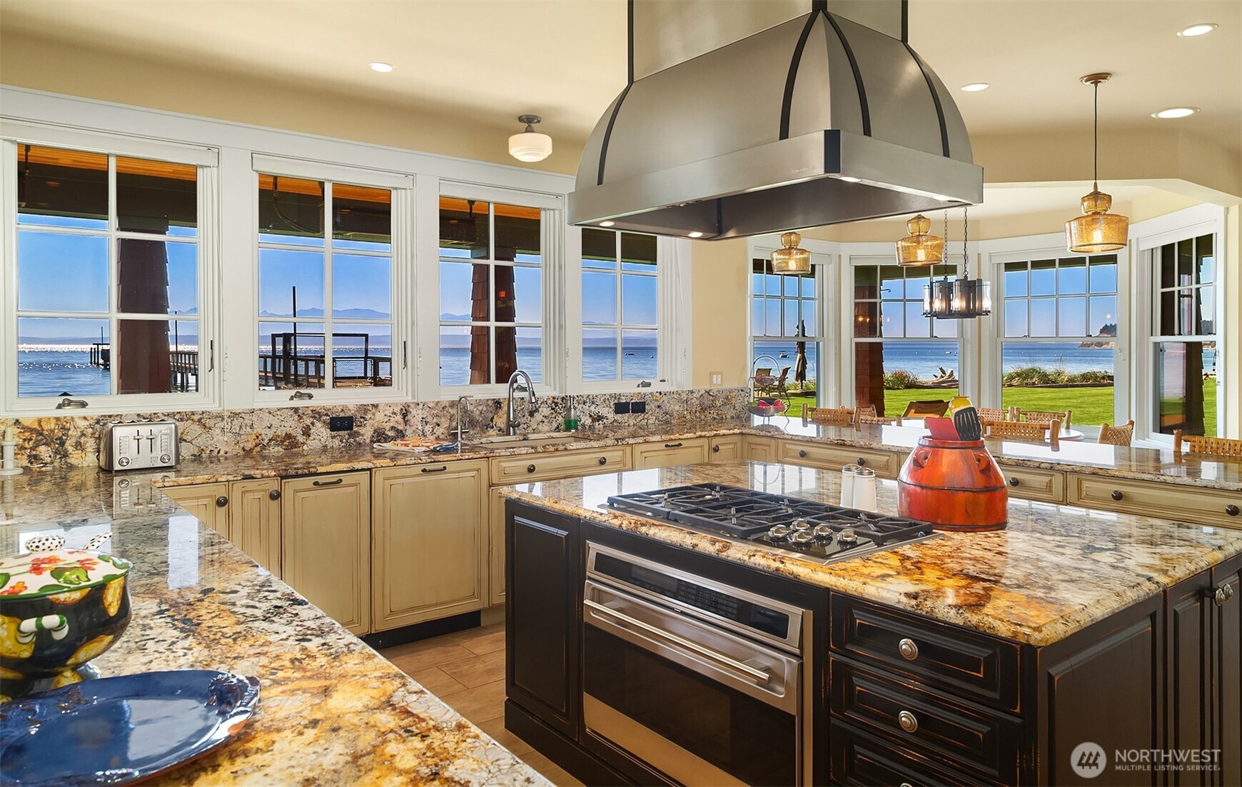 5844 Mutiny Bay Road Freeland, WA 98249 - Photo 29 of 35 a kitchen with stainless steel appliances granite countertop a stove and a sink