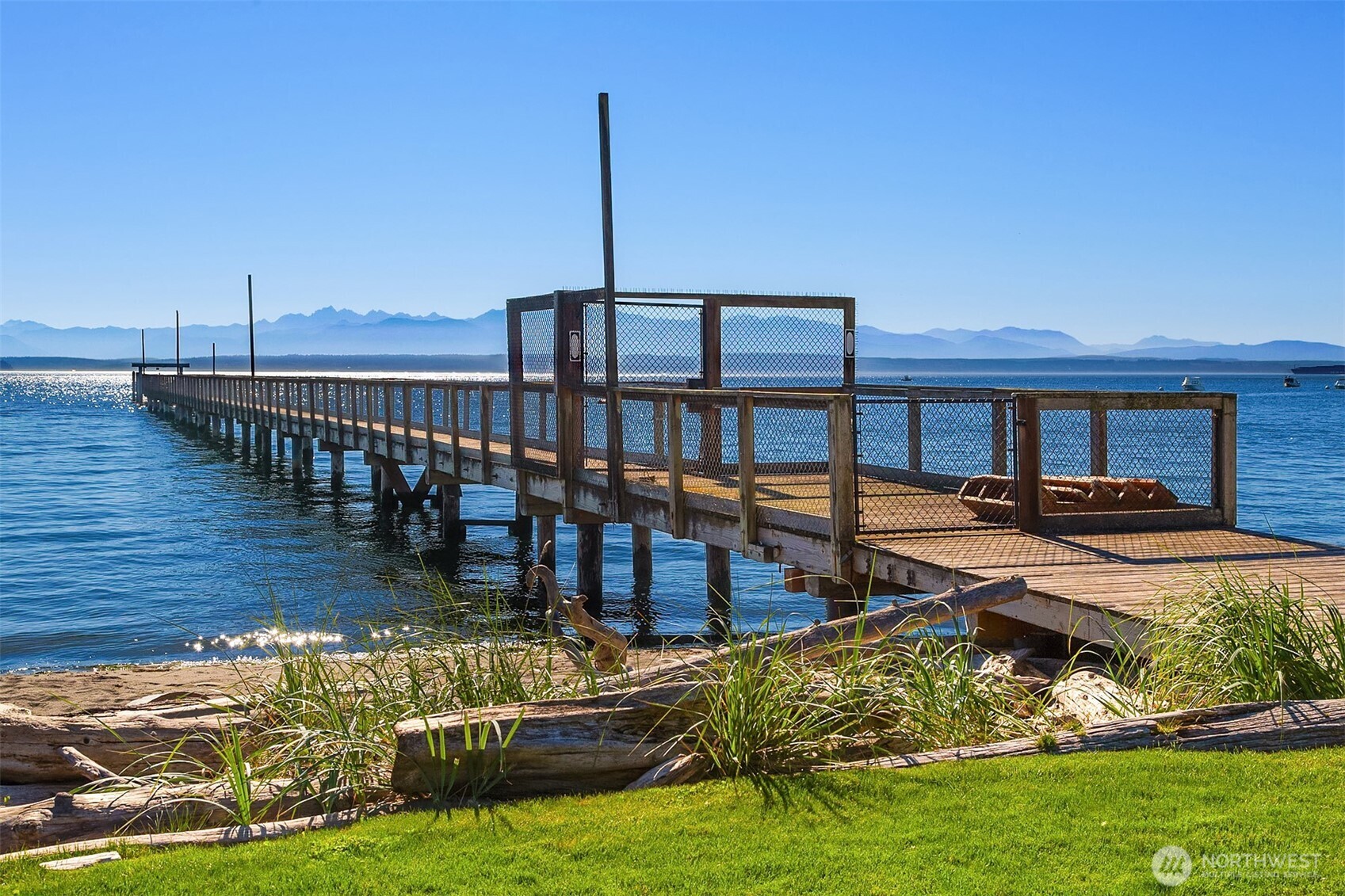 5844 Mutiny Bay Road Freeland, WA 98249 - Photo 34 of 35 a view of a swimming pool with a garden and deck