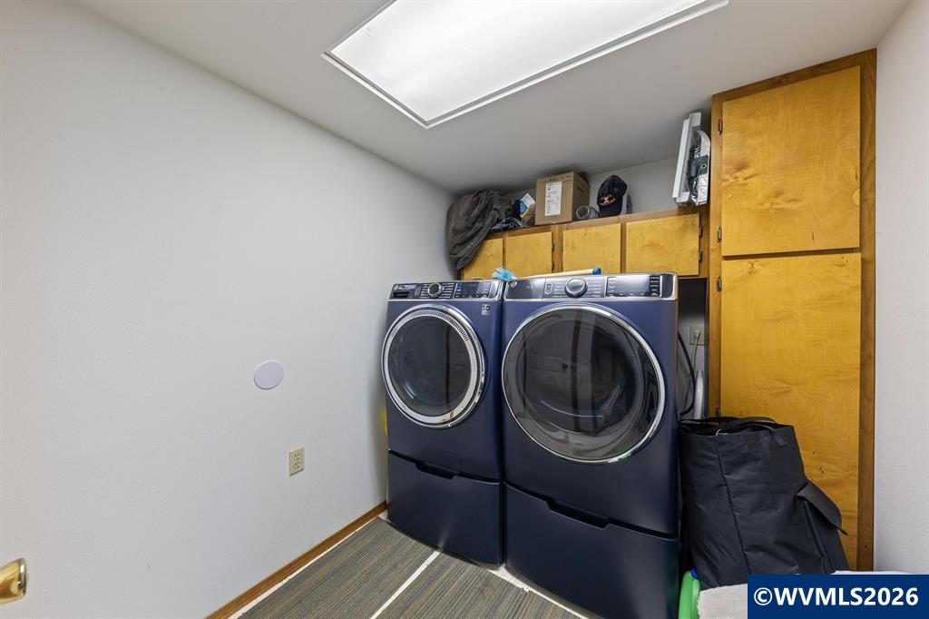 6100 Teal Creek Road Dallas, OR 97338 - Photo 27 of 41 a utility room with dryer and washer