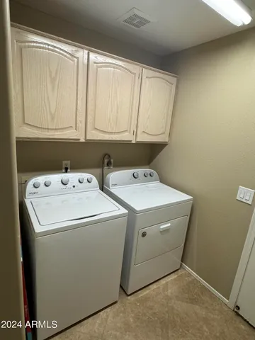 a kitchen with stainless steel appliances granite countertop a sink stove and microwave