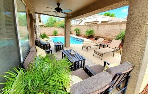 a view of a swimming pool with a patio
