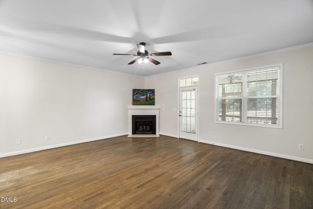 a view of a kitchen with wooden floor and a sink