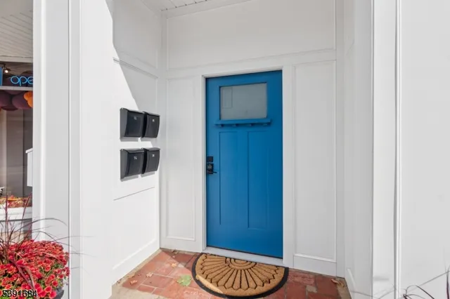 a view of room with furniture and wooden floor