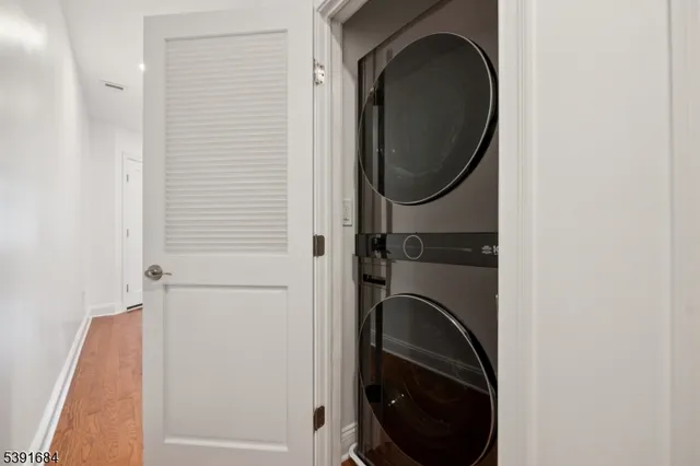 a close view of a utility room with dryer and washer