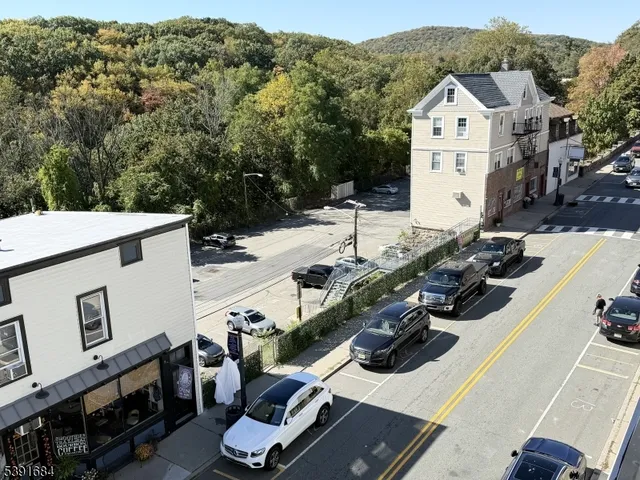 an aerial view of a house with swimming pool