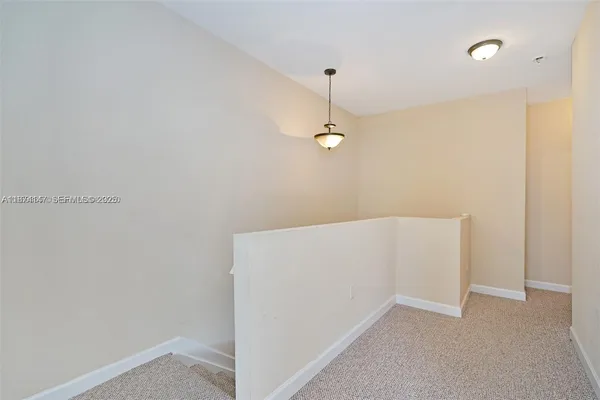 a view of a room with a fan