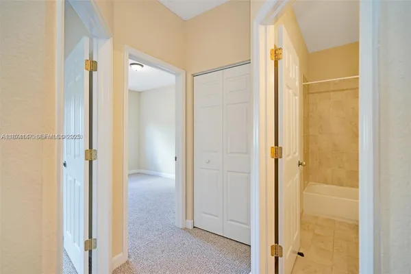 a view of a bathroom with a glass door