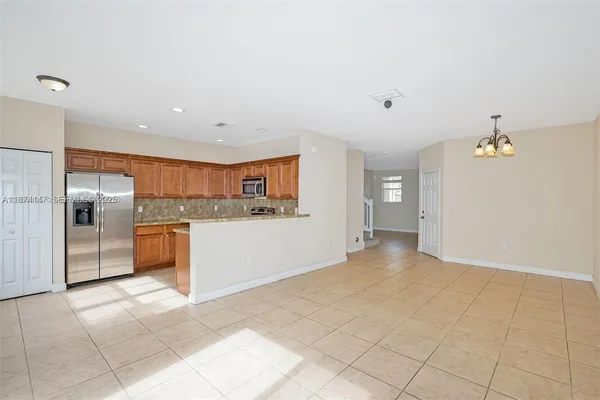 a view of a kitchen with a sink and an oven