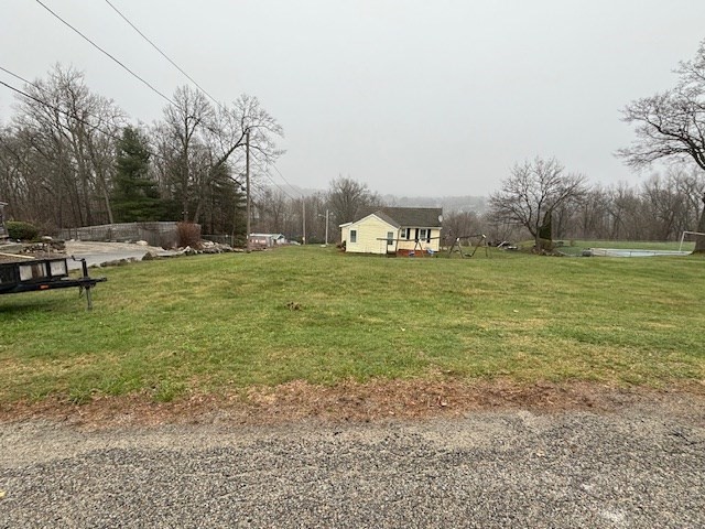 a fire hydrant in the middle of a field