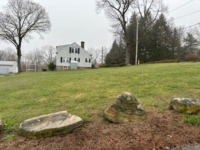 27 Havana Road Worcester, MA 01603 - Photo 6 of 6 a view of a backyard with plants and a tree
