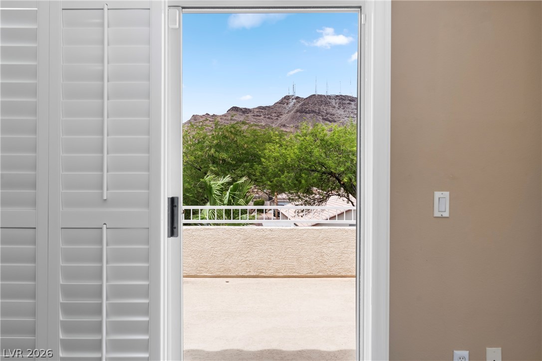 708 Vortex Avenue Henderson, NV 89002 - Photo 35 of 71 Framed mountain views from a private balcony, offering serene outdoor enjoyment.