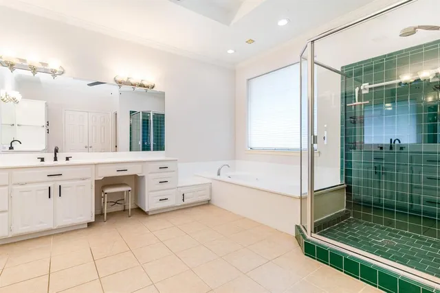 a spacious bathroom with a double vanity sink a mirror and a shower