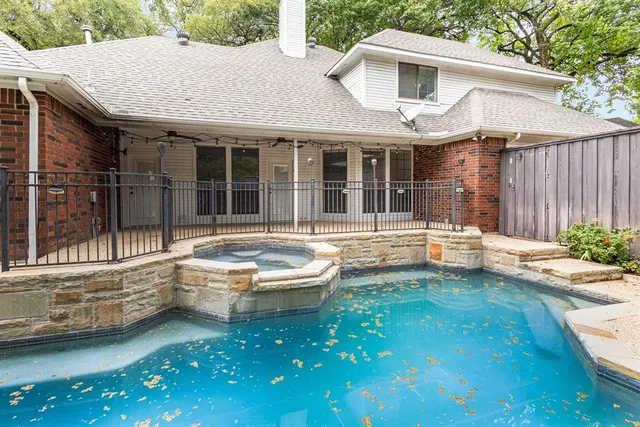 a backyard of a house with yard and outdoor seating
