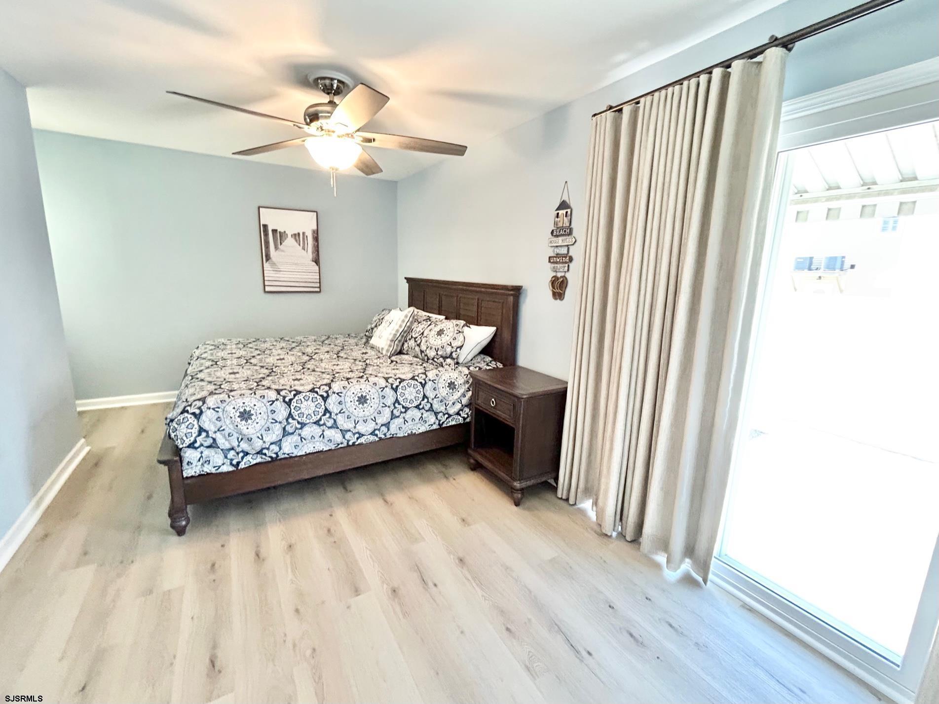 302 Sheridan Place Brigantine, NJ 08203 - Photo 8 of 15 a bedroom with a bed and a window