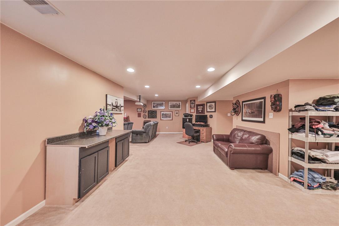 138 Clover Hollow Road Easton, PA 18045 - Photo 65 of 95 A versatile basement recreation area offers ample space for various activities and storage solutions.