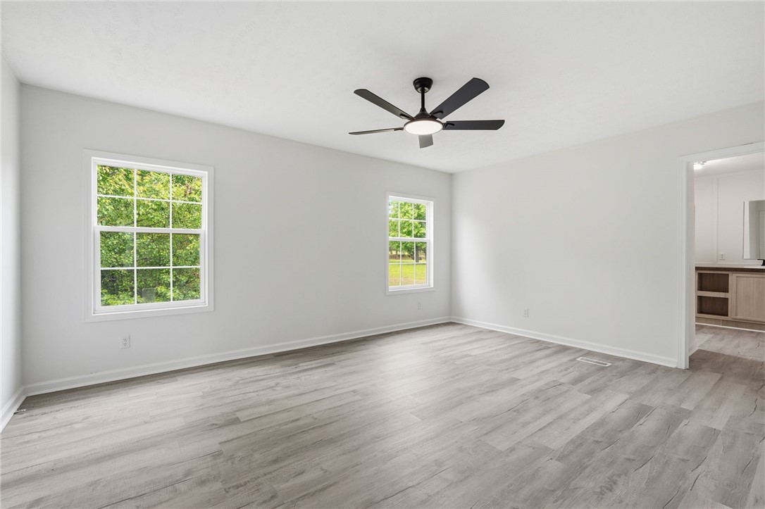 112 Sir Francis Drake Way Liberty, SC 29657 - Photo 35 of 42 Bright and airy room with serene views of lush greenery through large windows.