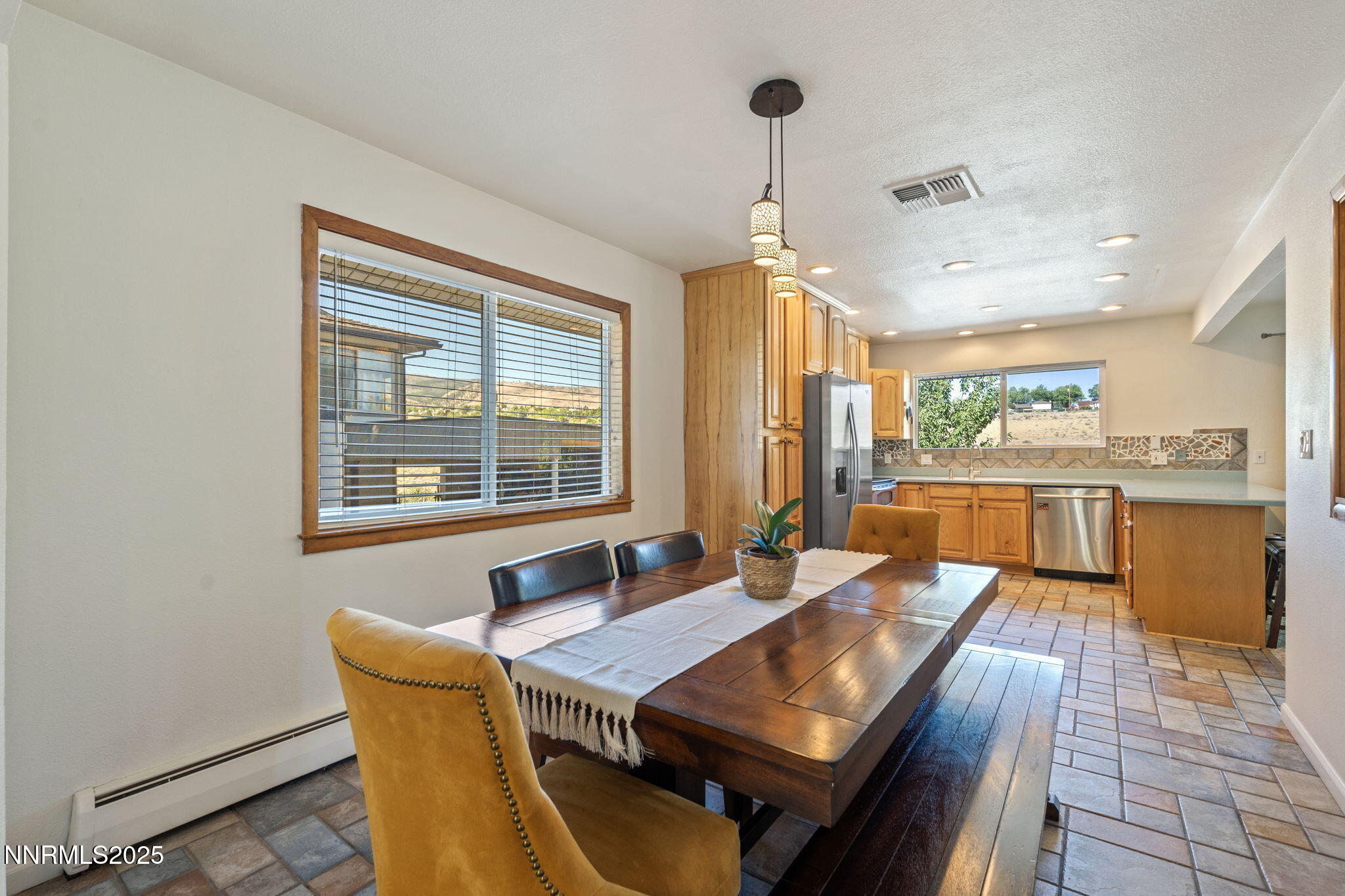2275 Solari Drive Reno, NV 89509 - Photo 11 of 52 a view of a dining room with furniture window and wooden floor