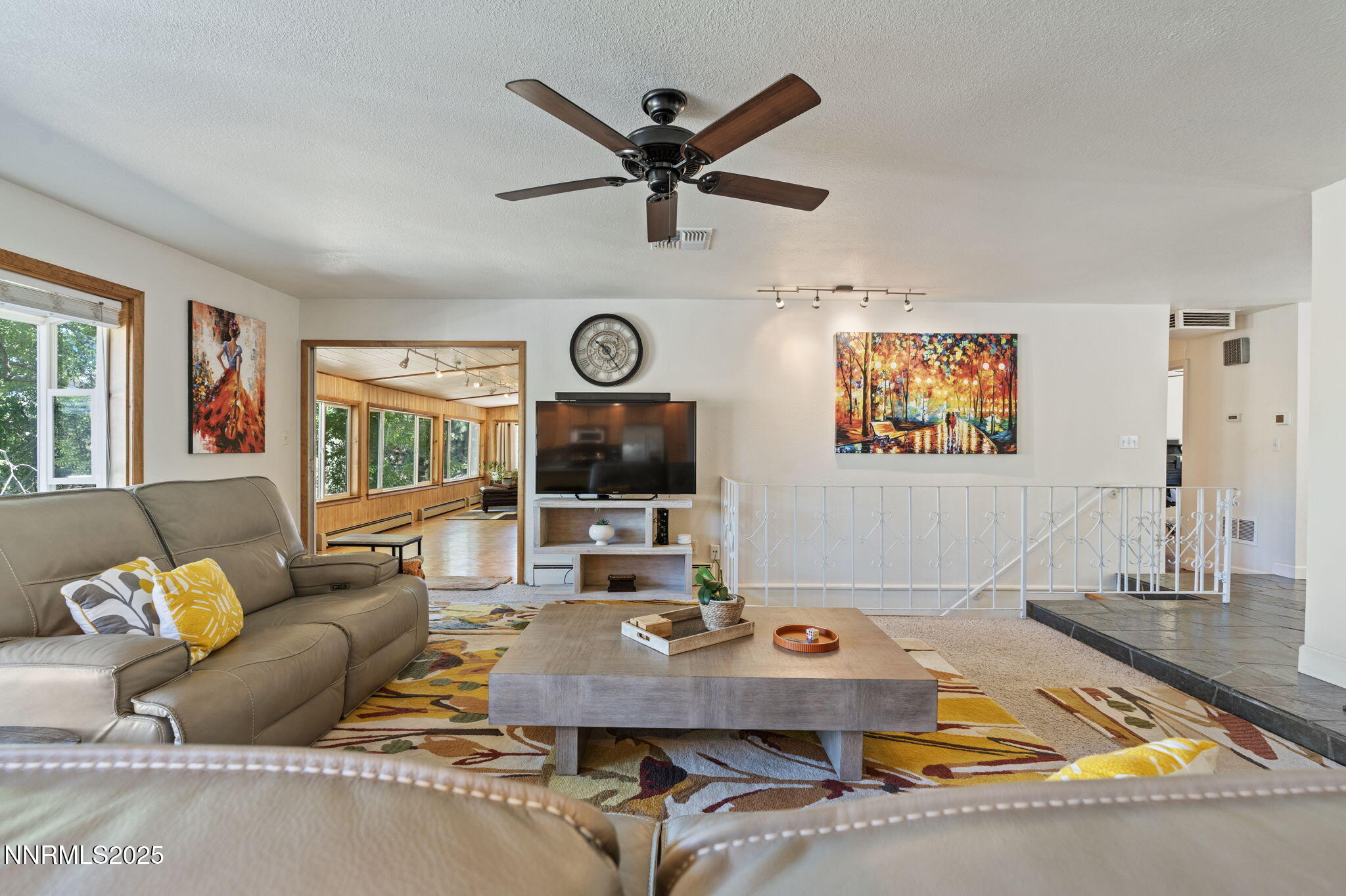 2275 Solari Drive Reno, NV 89509 - Photo 18 of 52 a living room with furniture and a clock