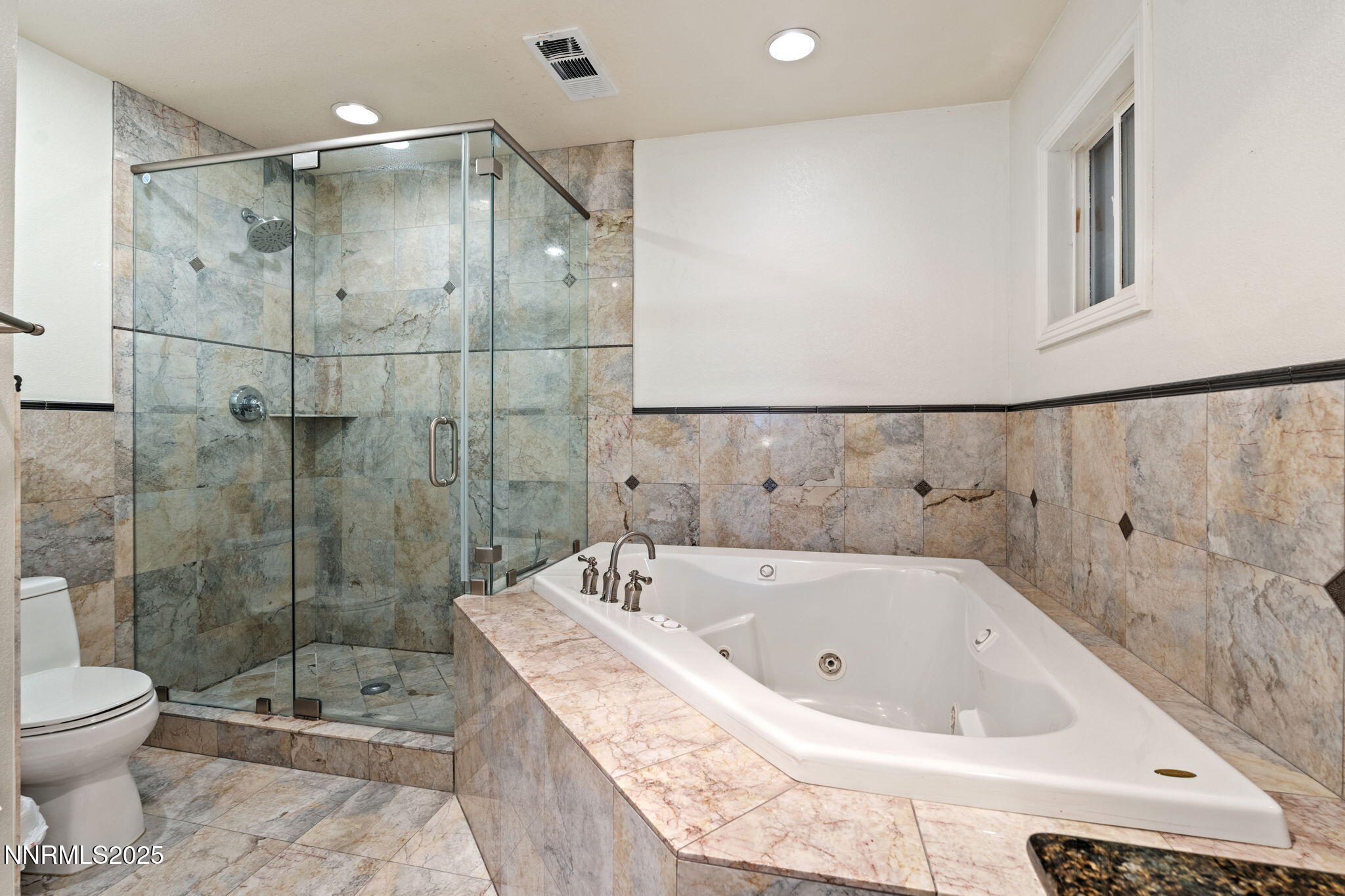 2275 Solari Drive Reno, NV 89509 - Photo 26 of 52 a bathroom with a bathtub and a shower
