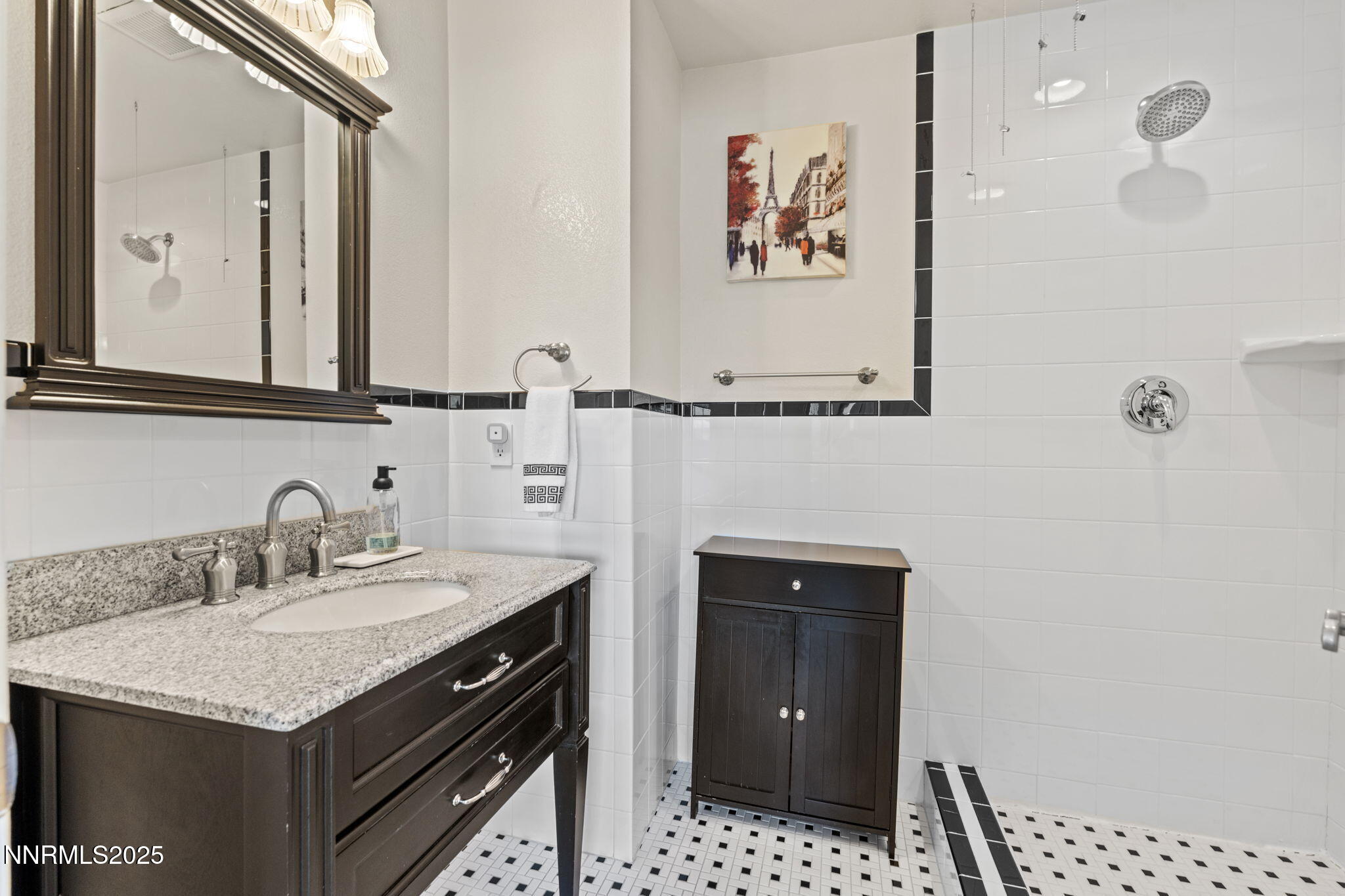2275 Solari Drive Reno, NV 89509 - Photo 30 of 52 a bathroom with a sink and a mirror