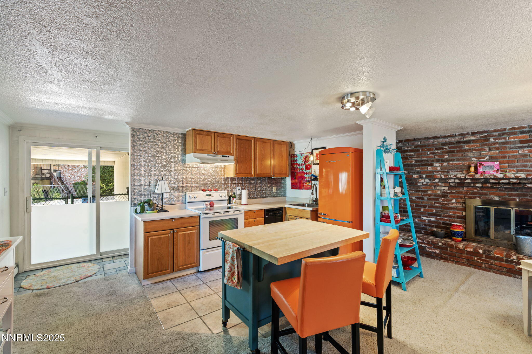 2275 Solari Drive Reno, NV 89509 - Photo 36 of 52 a living room with furniture a flat screen tv and a fireplace
