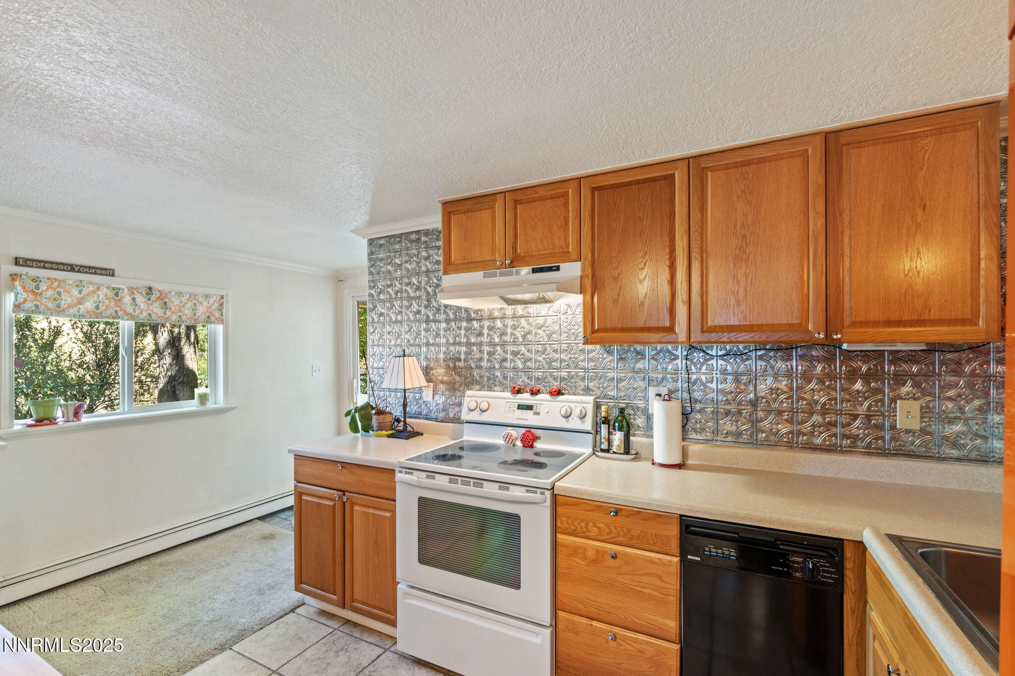 2275 Solari Drive Reno, NV 89509 - Photo 37 of 52 a kitchen with stainless steel appliances a sink stove and cabinets