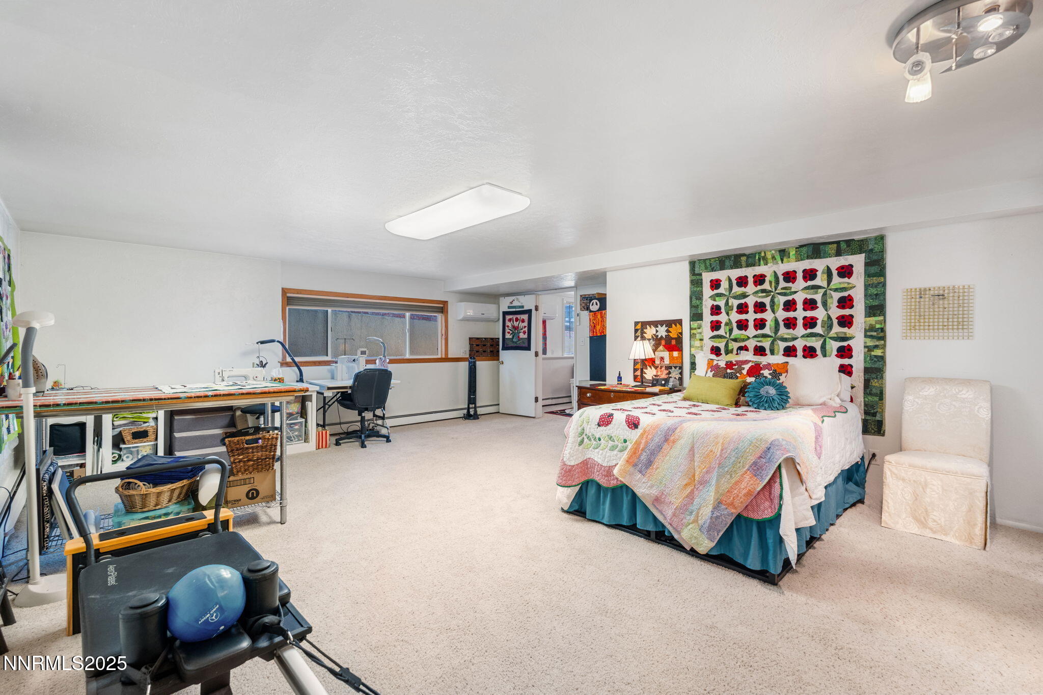 2275 Solari Drive Reno, NV 89509 - Photo 39 of 52 a spacious bedroom with a bed a desk and chair