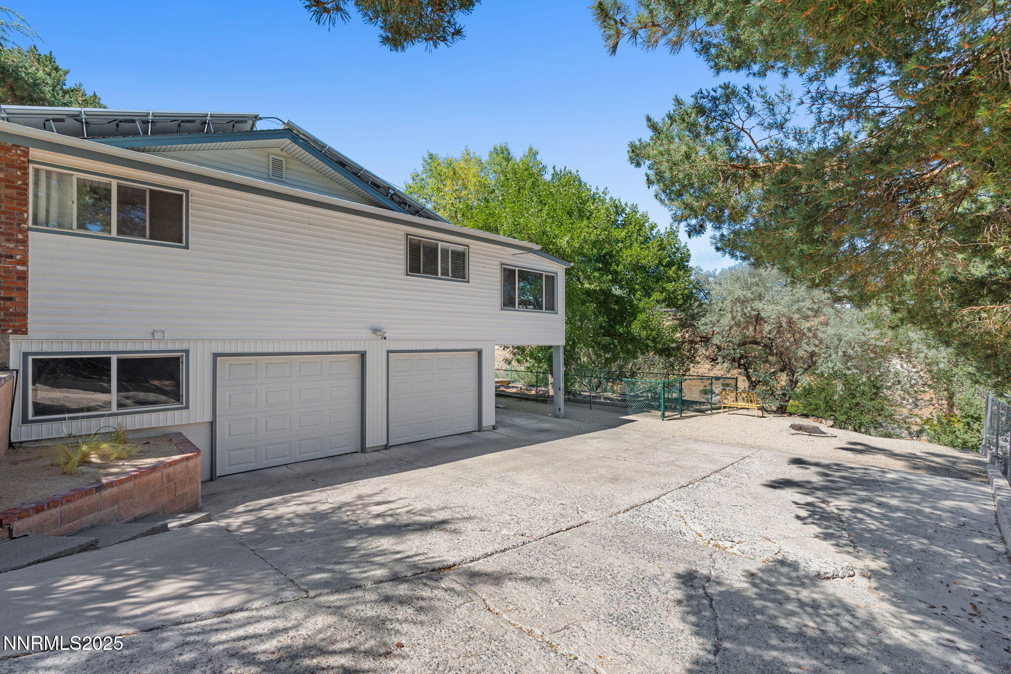 2275 Solari Drive Reno, NV 89509 - Photo 44 of 52 a front view of a house with a yard and garage