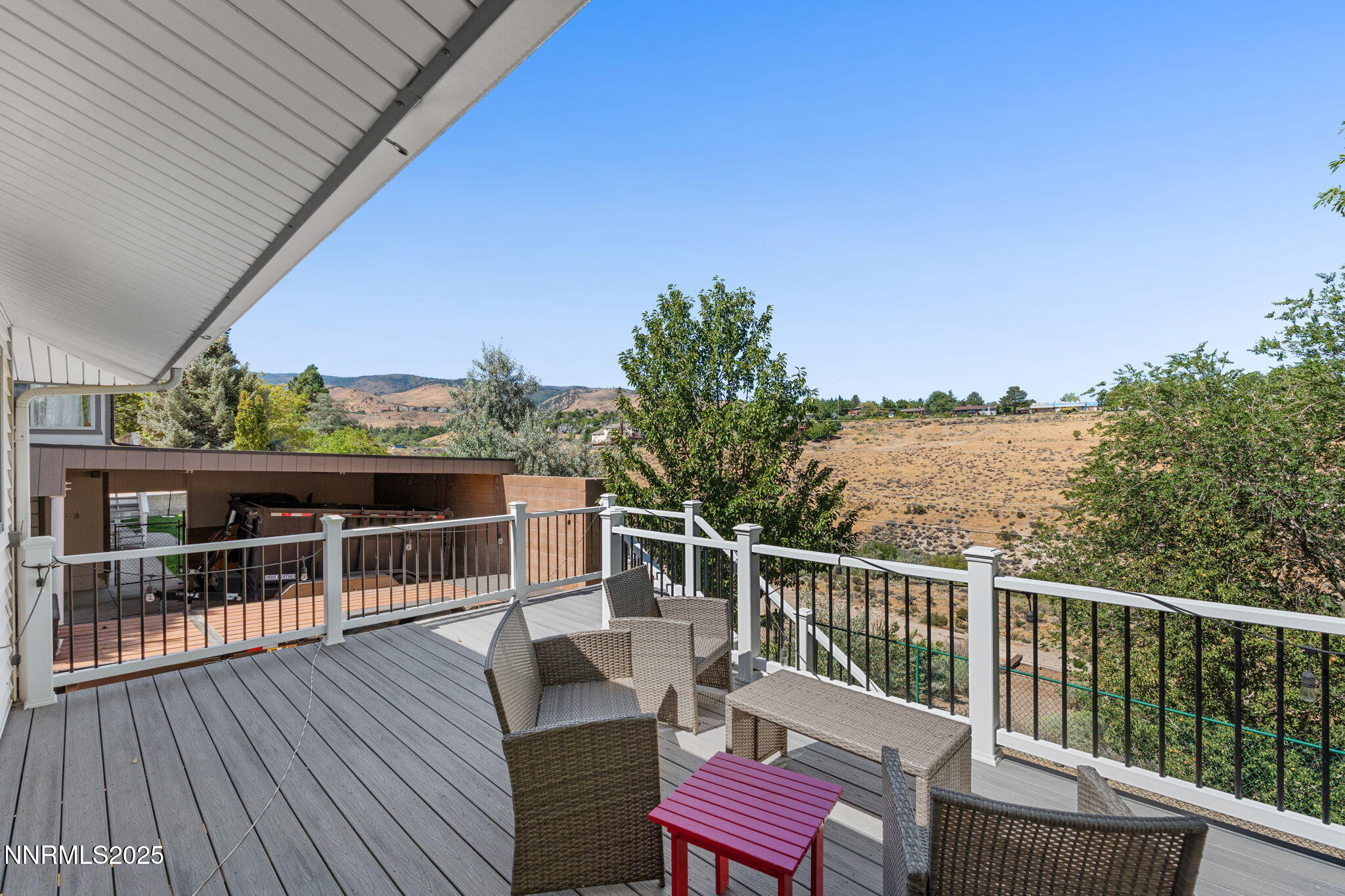 2275 Solari Drive Reno, NV 89509 - Photo 47 of 52 a view of a balcony with wooden floor and outdoor seating