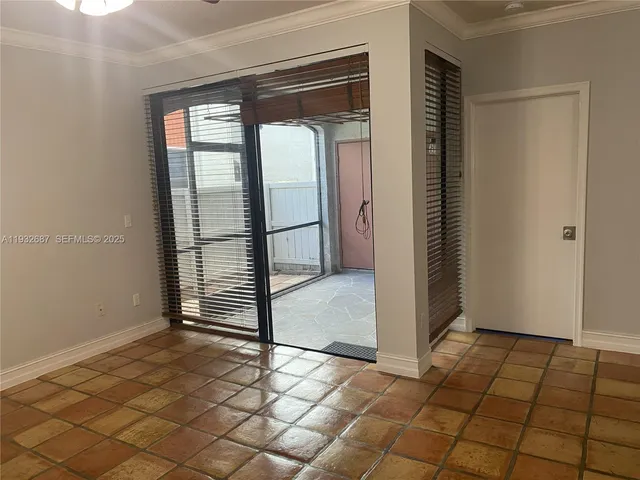 a view of a livingroom with wooden floor and a window
