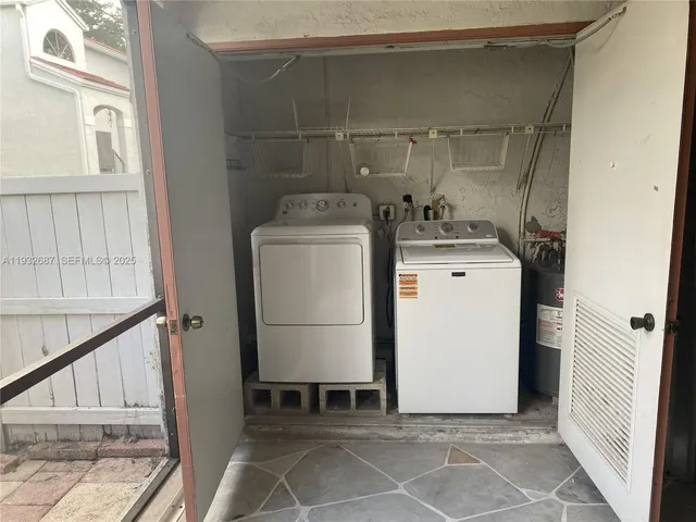 a utility room with dryer and washer