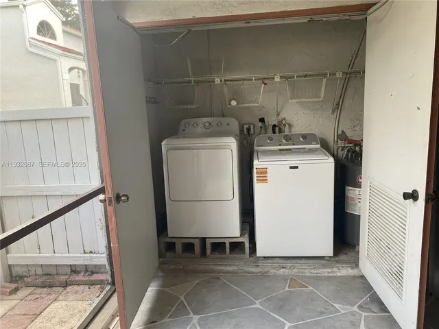 a utility room with dryer and washer