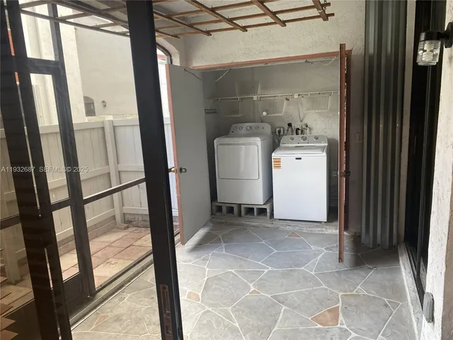a view of bathroom with a sink and mirror