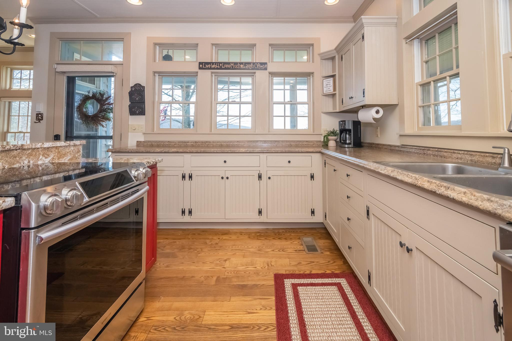 726 Sunset Ridge Drive McHenry, MD 21541 - Photo 11 of 50 a kitchen with granite countertop white cabinets and window